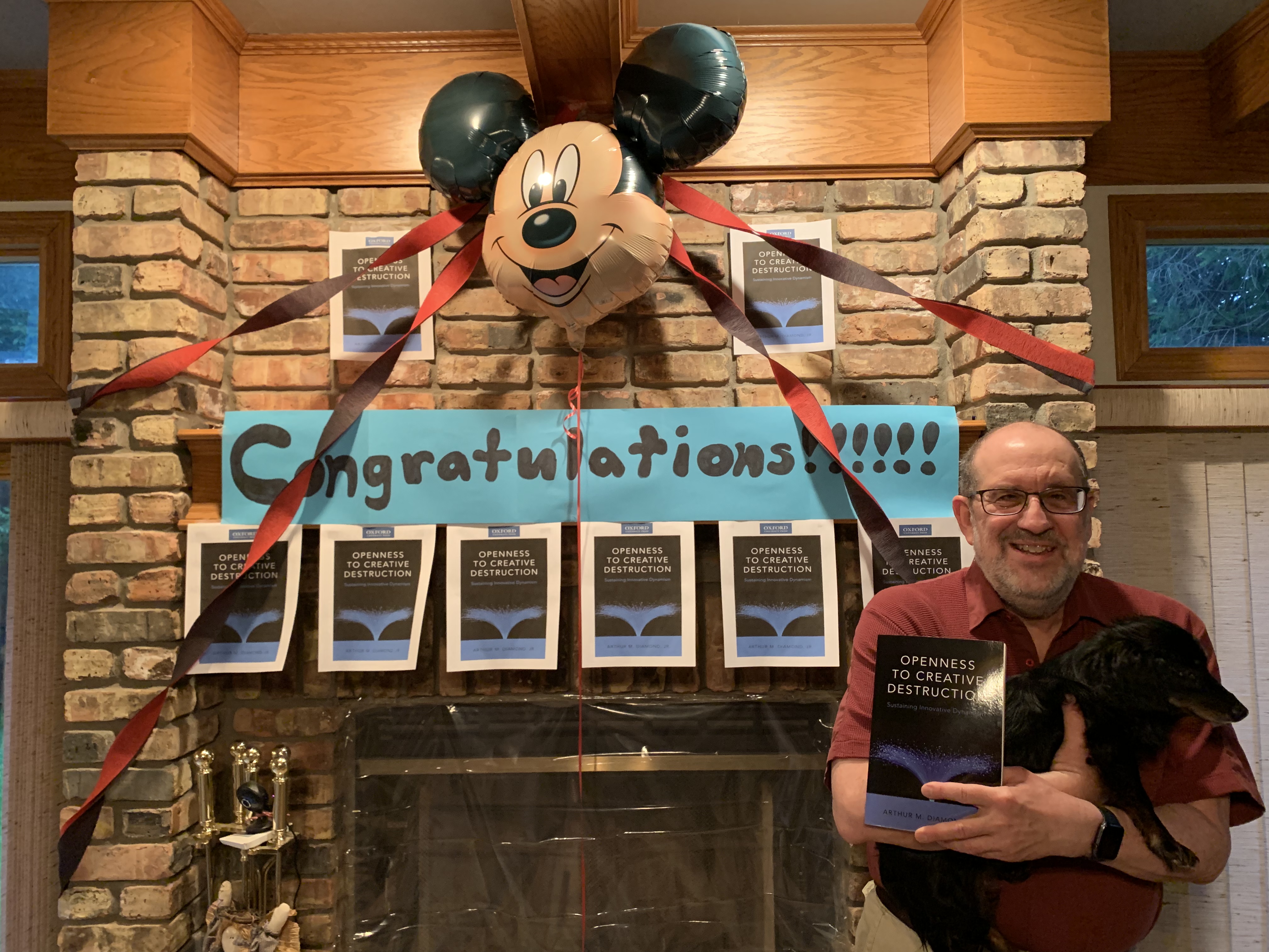 Art Diamond next to sign saying "Congratulations!".