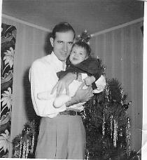 Dad holding me as a baby in 1953.